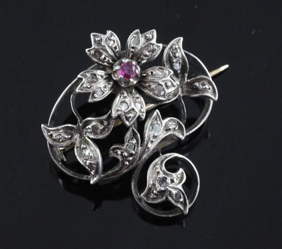 A late 19th century French 18ct gold and silver, ruby and rose cut diamond brooch, width 1.25in.